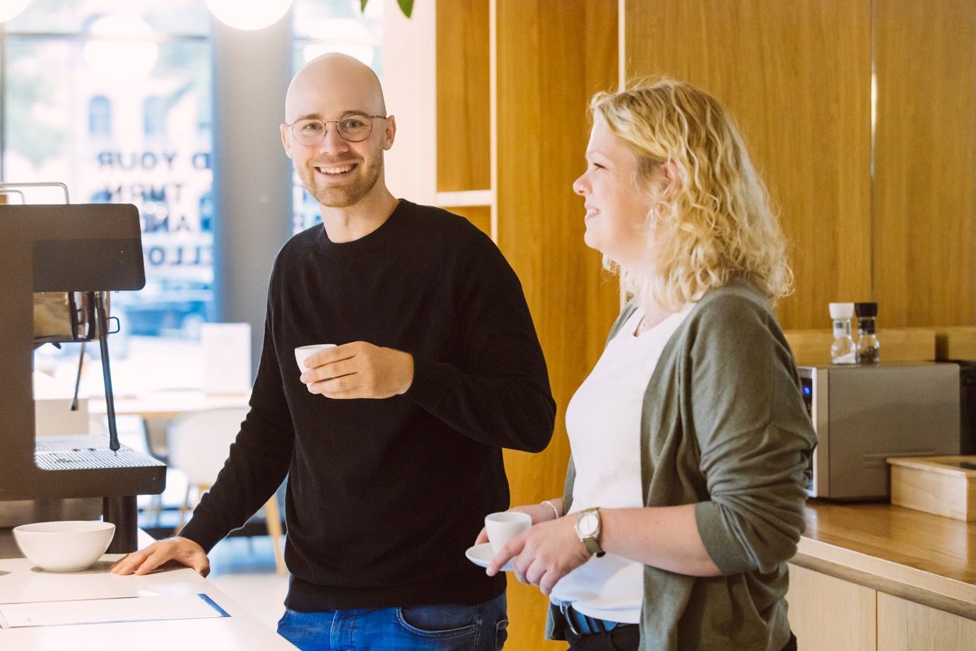 Colleagues at the office coffee bar